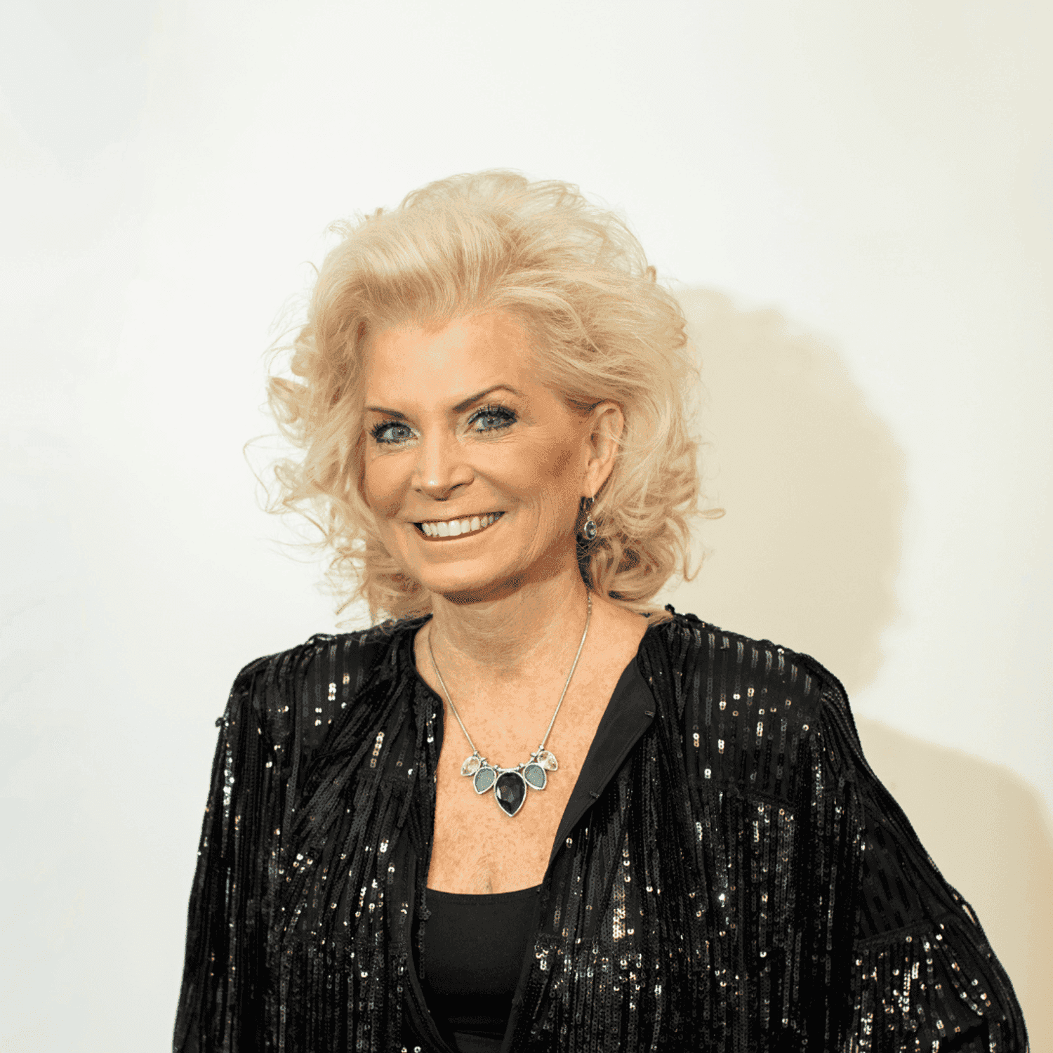 Portrait of Cathy Brown-Issel, a professional stylist at Brown & DeLine Salon, showcasing their expertise and style.