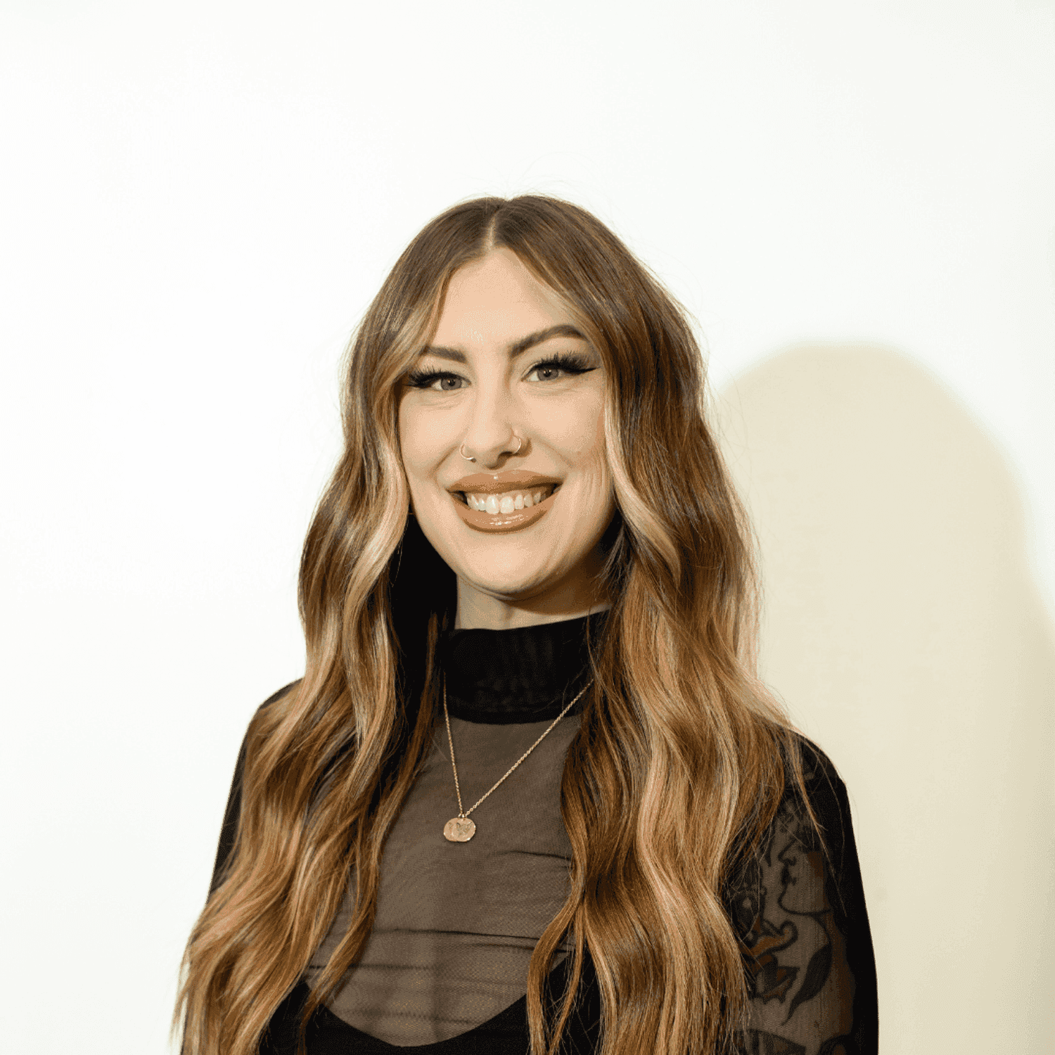 Portrait of Ashley Lamping, a professional stylist at Brown & DeLine Salon, showcasing their expertise and style.