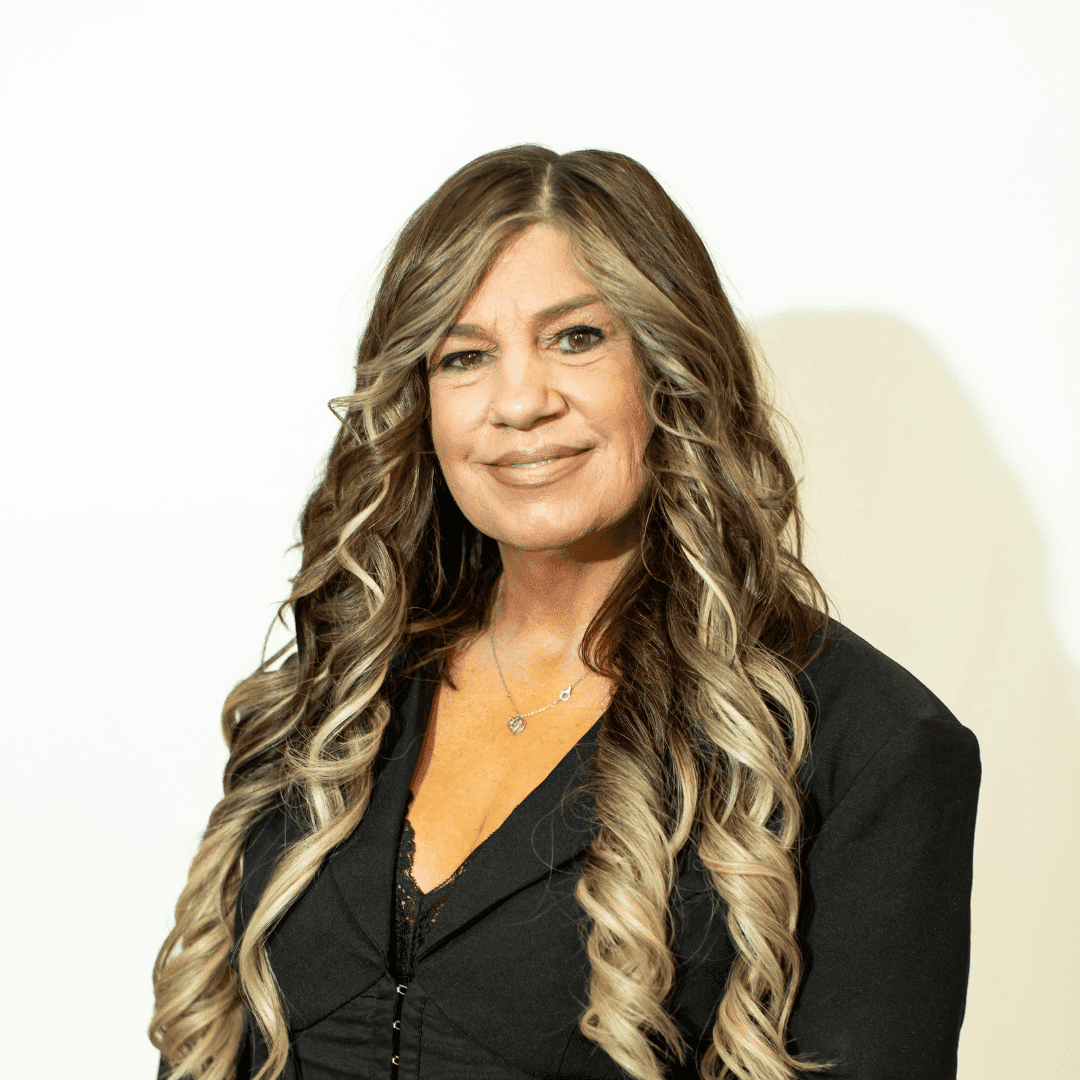 Portrait of Shannon Rodriguez, a professional stylist at Brown & DeLine Salon, showcasing their expertise and style.