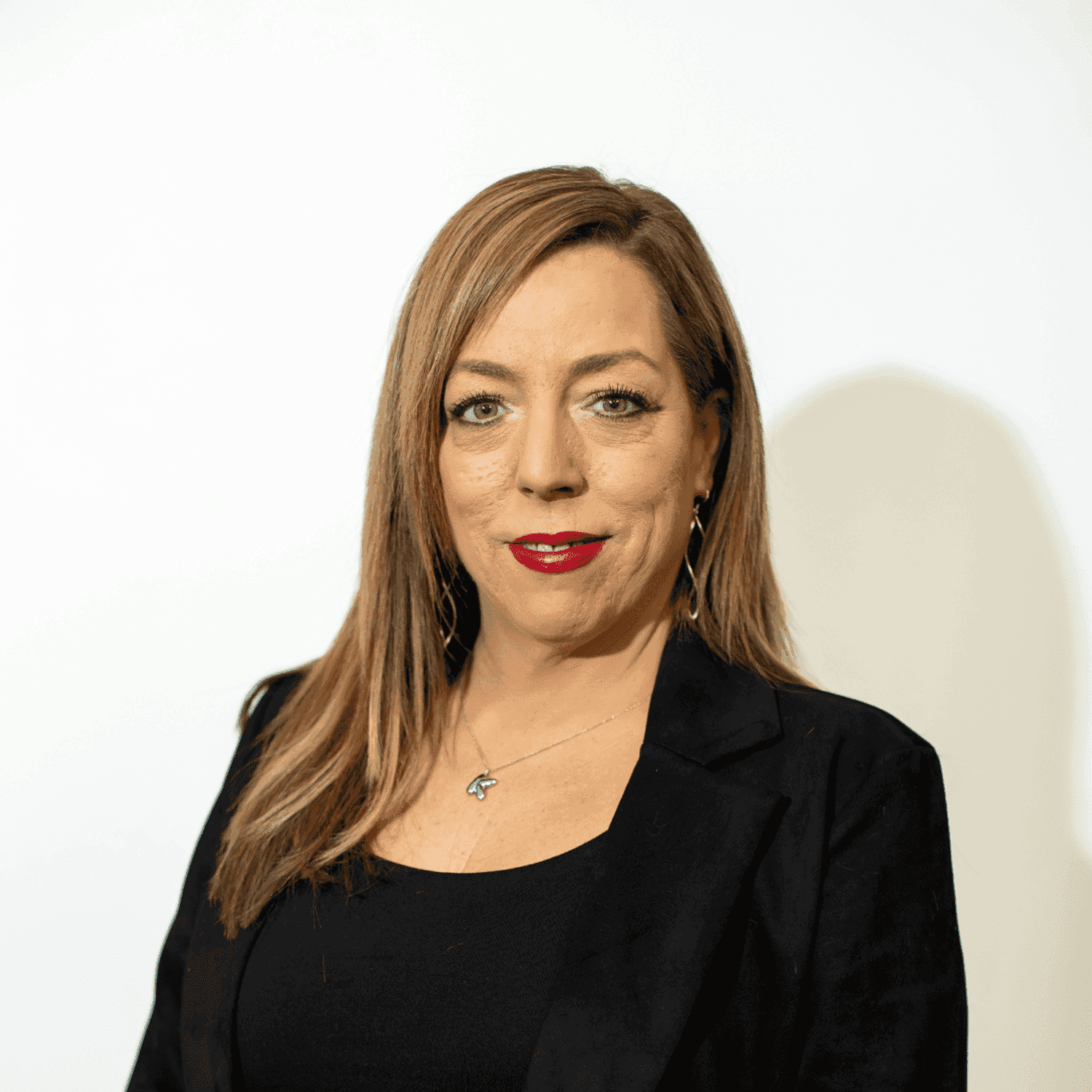 Portrait of Kristy Williams, a professional stylist at Brown & DeLine Salon, showcasing their expertise and style.