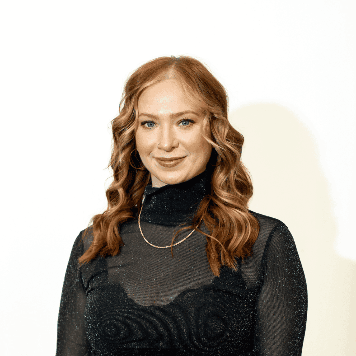 Portrait of Paige Chessor, a professional stylist at Brown & DeLine Salon, showcasing their expertise and style.