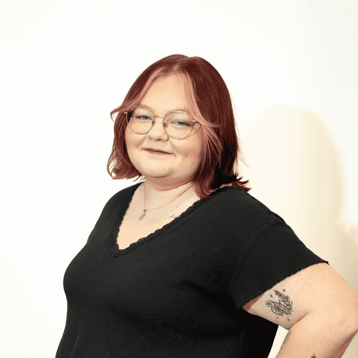 Portrait of Mikayla Bournay, a professional stylist at Brown & DeLine Salon, showcasing their expertise and style.