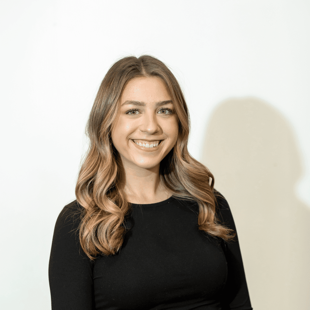 Portrait of Olivia Henry, a professional stylist at Brown & DeLine Salon, showcasing their expertise and style.