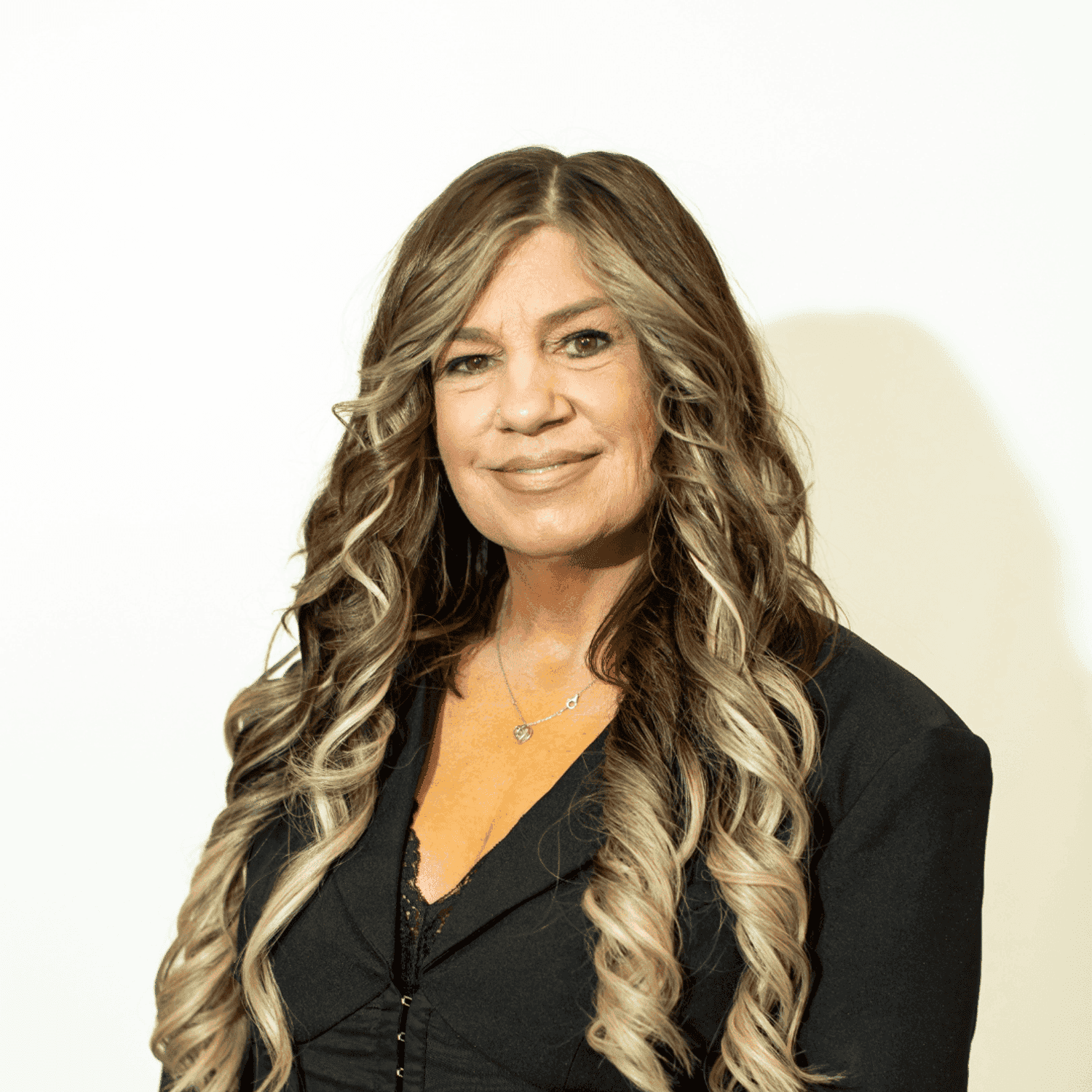 Portrait of Shannon Rodriguez, a professional stylist at Brown & DeLine Salon, showcasing their expertise and style.