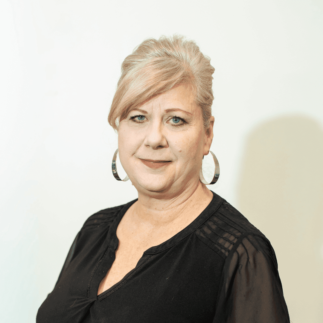 Portrait of Claire Osterberg, a professional stylist at Brown & DeLine Salon, showcasing their expertise and style.