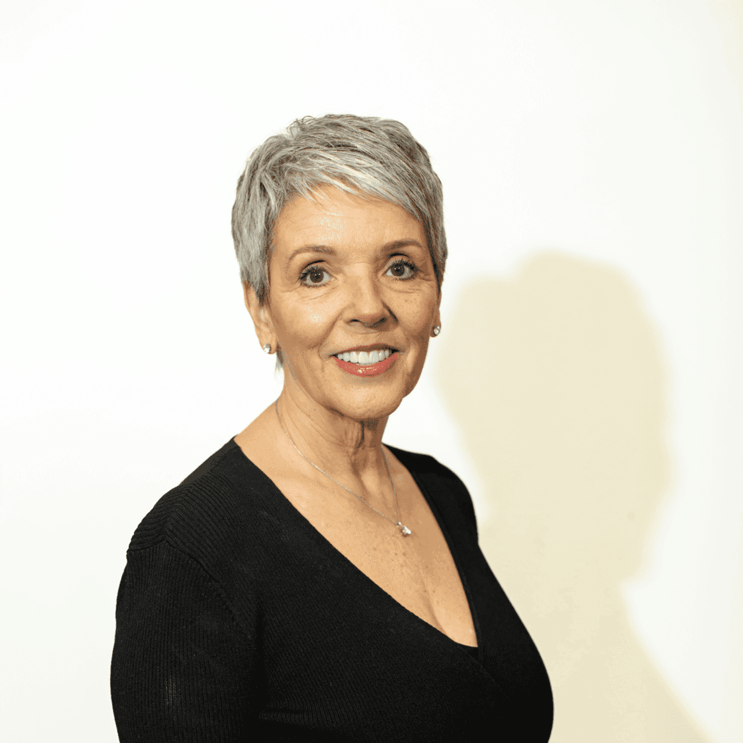 Portrait of Louise Basten, a professional stylist at Brown & DeLine Salon, showcasing their expertise and style.